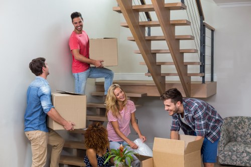 Professional packers at work handling customer belongings.