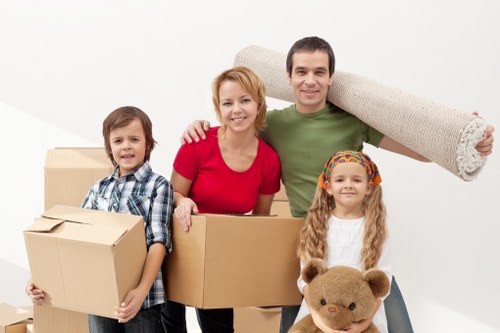 Team members packing items securely with quality materials.